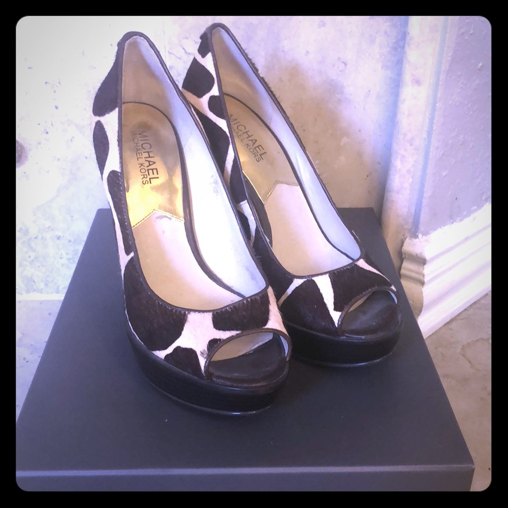 Size 7 Michael Kors wedge animal print shoes.
